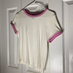 White t-shirt with pink accents